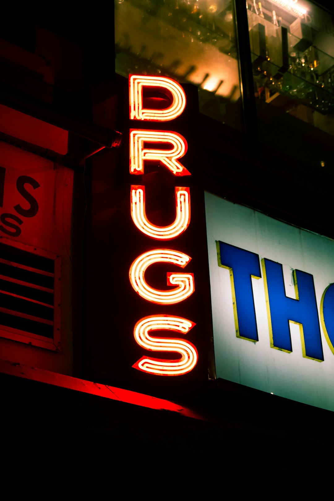 a-lit-up-sign-that-says-drugs-and-thor-gh8ab42uoqa